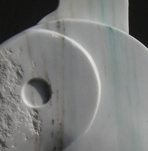Detail of the gold and emerald green veining in the white Colorado Yule Marble sculpture Yin Yang by Kelly Borsheim