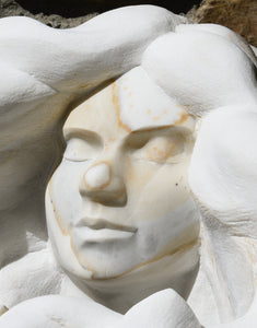 Face detail from right Serenity Marble sculpture portrait of a serene woman with flowing locks of wavy hair marble art