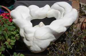 Top view, bird's eye view of Serenity marble sculpture.  Note the hole in the center base of the sculpture, and the triangle shape of the marble art