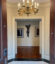 Load image into Gallery viewer, Statement art makes a great impression when guests and family enter the front door of this elegant home.
