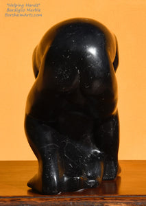 Back view of man's body black Bardiglio marble Helping Hands figure sculpture