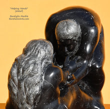 Load image into Gallery viewer, Another view of the man's bearded face in this black marble figure sculpture titled Helping Hands.  You may also see the textured waves in the woman's hair.