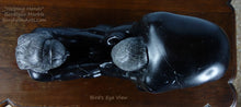 Load image into Gallery viewer, Bird's eye view or view from the top of this tabletop sculpture Helping Hands by Kelly Borsheim Couple Art Carved from a black marble, now polished, this sculpture depicts a man bending over forward to help a seated woman stand up.  Her hands reach up towards his bearded face, but it is the moment before she is close enough to reach him.