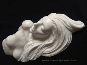 white marble portrait including nude upper torso sculpture of a woman with long flowing hair by Japanese artist Kumiko Suzuki
