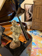 Cargar imagen en el visor de la galería, Bronze tabletop statue on a piano with a painting of a nude dancer figure in the background
