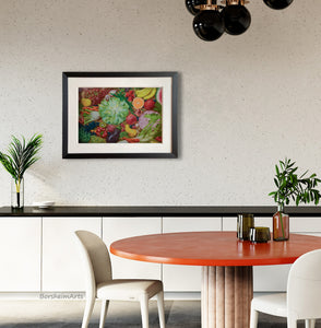 Dining room with a round wooden table, white chairs, and a colorful framed picture of an abundance of fresh produce on the wall.