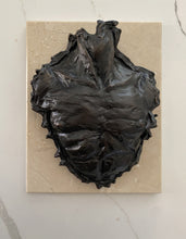 Cargar imagen en el visor de la galería, Bronze abstract sculpture (detail of a man's chest) on a cream rectangular stone base against a light marble background

