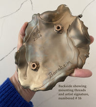 Cargar imagen en el visor de la galería, Metallic sculpture held by a hand with 'Borsheim' branding and numbering # 17 and showing threaded nuts for mounting on a light background
