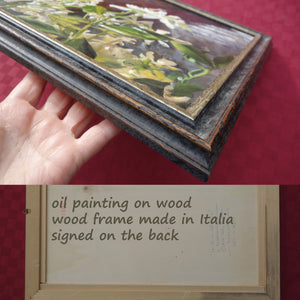 Side view of wood frame of painting on primed wood panel.  shown with artist's hand to show scale of artwork's other floral jasmine painting in this pair of two.