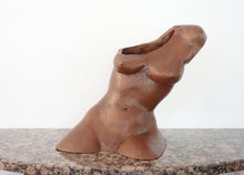 Laden Sie das Bild in den Galerie-Viewer, Terra-cotta hollow sculpture of a woman's torso sitting on a granite table, front view showing opening over one shoulder
