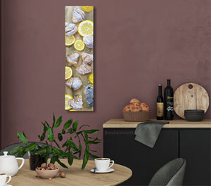 Italian breakfast painting inspired by lemon cream pastries hangs vertically in burgundy wall kitchen nook with small dining table.  Still life painting art by Kelly Borsheim