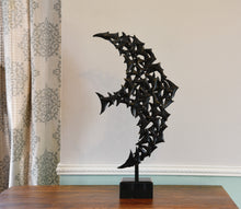 Carica l&#39;immagine nel visualizzatore di Gallery, Front view of profile of large flying bird made up of many small birds.  Negative space shows in the body. Shown on a dresser top.
