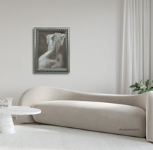 將圖片載入圖庫檢視器 Framed painting of a woman's natural back on a wall above a modern beige sofa in a minimalist room.
