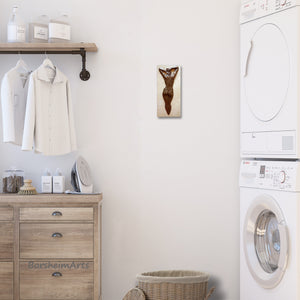 This classically created bronze nude figure adds a touch of elegance to this laundry room.