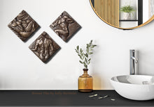 將圖片載入圖庫檢視器 Bronze tiles with bronze artistic designs on a bathroom wall, featuring a sink and decorative plant.
