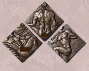 Three bronze sculptures of nude figures on a textured wall background