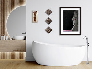 Modern bathroom with a freestanding bathtub, wall art, and a mirror.