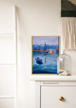 Laden Sie das Bild in den Galerie-Viewer, Framed artwork of a harbor scene on a white wall with decorative elements.
