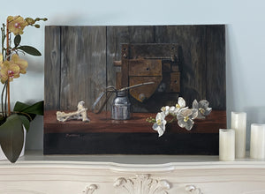 Decorative still life painting Orchids and Old Things (big rusty square door lock, silver oil can, and a bone)  on a mantle and pale blue wall with flowers and candles on either side.