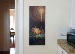 Painting of a still life scene with a pumpkin, vase, and candle on a wall in a kitchen.