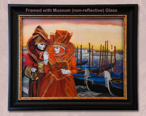 Framed artwork of two people in elaborate orange and red Carnevale costumes by a canal with gondolas in Venice, Italy. shown in actual frame with Museum Glass (a trademarked brand of non-reflective glass)