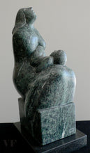 Carica l&#39;immagine nel visualizzatore di Gallery, Green stone sculpture of a seated mother figure with a child on her lap.  she is looking upwards.  a gray background
