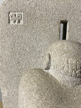 Laden Sie das Bild in den Galerie-Viewer, Close-up of a stone sculpture with a textured surface and the artist Vasily Fedorouk&#39; signature logo carved into the limestone.
