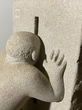 Laden Sie das Bild in den Galerie-Viewer, Detail of Stone sculpture of a person reaching out with one hand against a plain background, grey limestone carving
