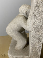 Laden Sie das Bild in den Galerie-Viewer, Stone sculpture of a figure pleasuring himself while looking through a hole in a wall against a neutral background
