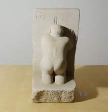 Laden Sie das Bild in den Galerie-Viewer, Back view of man bent down to peek through a slot in the wall while he masterbates.  Peeping Tom is a limestone carving by Vasily Fedorouk
