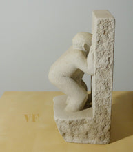 Laden Sie das Bild in den Galerie-Viewer, Profile of abstract male figure doing a Peeping Tom by looking through a stone wall.  His right ear and hand figure prominently... you see a shadow of his left arm reaching between his legs.
