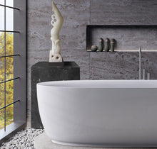 Laden Sie das Bild in den Galerie-Viewer, Modern bathroom with a freestanding bathtub, white marble figure sculpture &quot;Splash&quot; female diver, and decorative items.
