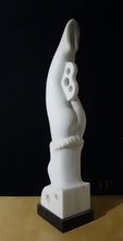 Laden Sie das Bild in den Galerie-Viewer, 3/4 view of back and diver figure&#39;s right side, female body carved from white marble with black stone base.  shown on natural wood table and black background
