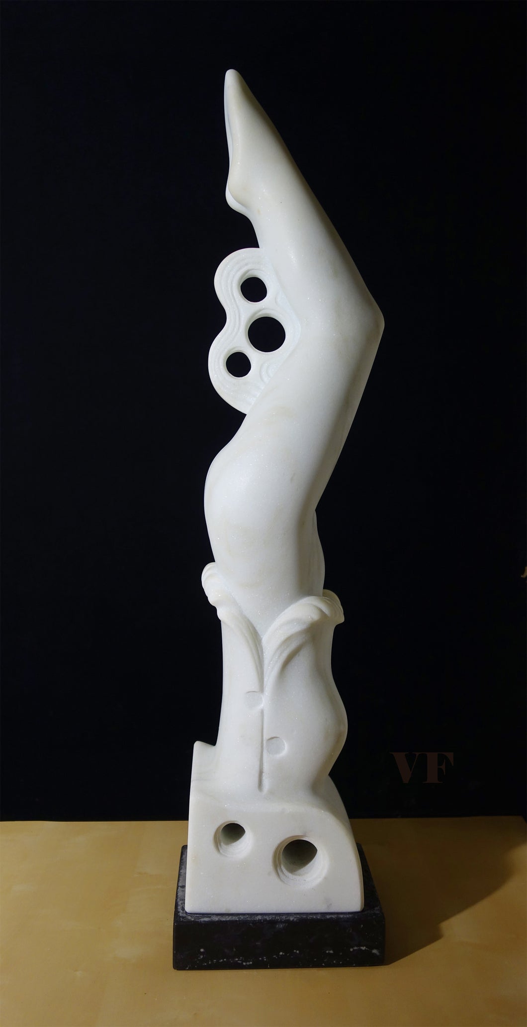 White abstract sculpture of female diver on a black background, profile view facing right, contemporary 3-d art for poolside