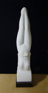 White marble sculpture of a diving female figure with legs together as she enters the water with a Splash.  Front of torso viewpoint, white statue on a black background