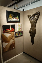 Laden Sie das Bild in den Galerie-Viewer, An art gallery corner with beige walls displaying framed paintings and a large bronze sculpture of a nude female figure.  Includes a cornucopia style still life oil painting in the simple black frame.  Shown for size comparison with other artworks by Kelly Borsheim
