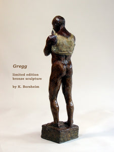 Back view of standing man nude from the waste down as he pulls up the front of his shirt to wipe his brow. limited edition bronze sculpture for tabletop