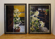 Charger l'image dans la galerie, Two framed paintings displayed side-by-side on a wooden surface against a white wall. The left painting depicts a dark wooden door and a potted plant with white jasmine flowers against a yellow wall.  The right one is flowering backlit jasmine with stone steps and gate in the background.
