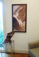 Carica l&#39;immagine nel visualizzatore di Gallery, Sculpture of a leaning female torso rests on a low table in front of a framed print of artist Kelly Borheim&#39;s &quot;The Triumph of Icarus.&quot; 

