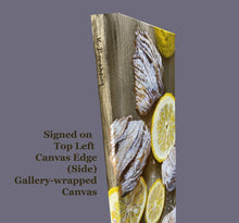 Load image into Gallery viewer, 3/4 view of top left side of gallery-wrapped canvas to show artist signature on the side edge of the food painting
