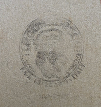 Load image into Gallery viewer, Circular emblem or logo stamped onto an Italian textured linen canvas, the backside
