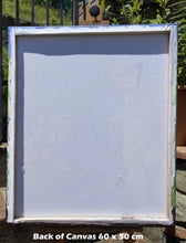 Load image into Gallery viewer, Back of a canvas with dimensions 60 x 50 cm, outdoors.
