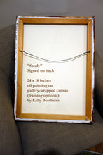 Laden Sie das Bild in den Galerie-Viewer, Back side of gallery-wrapped canvas painting sitting on a puffy chair.  Back of canvas shows the hanging wire and artist&#39;s signature.
