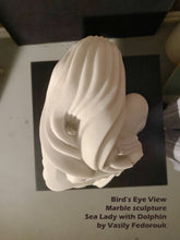 將圖片載入圖庫檢視器 View from the top looking downwards over a marble sculpture of a sea lady with a dolphin by Vasily Fedorouk on a black stand.
