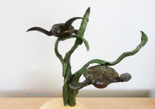 Charger l&#39;image dans la galerie, Bronze sculpture of two turtles on a three strands of sea kelp with a white background
