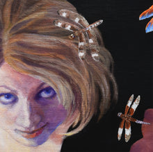 Laden Sie das Bild in den Galerie-Viewer, A close-up detail of a painted portrait of a woman with short light brown hair, blue eyes, and a small dragonfly flying over her hair, against a dark background with another dragonfly near the lower right.  Artist Kelly Borsheim holds the copyright.

