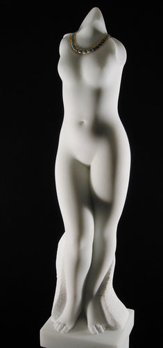 A vertical white marble statue of the body and legs of a female figure.  No head or arms, but beautiful.  Good and a greenish-turquoise stone was added to the marble as a necklace around the woman.  Mixed media sculpture of marble with gold by the late Ukrainian-American artist Vasily Fedorouk