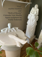 Carica l'immagine nel visualizzatore di Gallery, Marble fountain and sculptures by Vasily Fedorouk with text on a wall.
