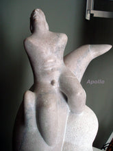 Load image into Gallery viewer, Detail of the simplified nude torso of the god Apollo as he rides sidesaddle on a dolphin.  His head tilts back as he looks to the heavens. 
