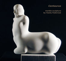 Laden Sie das Bild in den Galerie-Viewer, Profile view of beautiful male centaur carved from white marble with sensuous curves.  Artwork by Vasily Fedorouk
